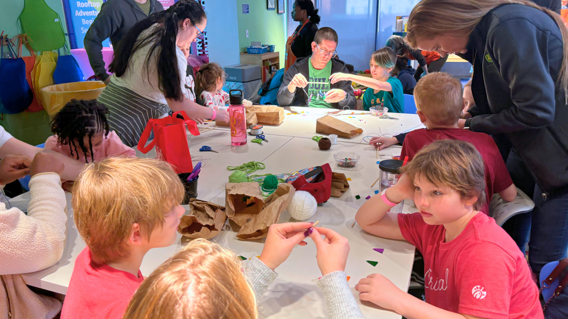 Children and parents building in a maker space