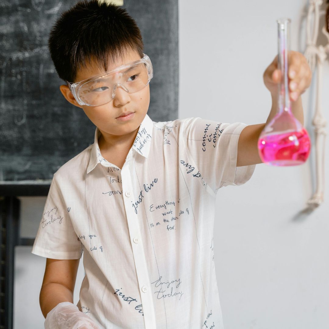 Boy holding molecule model