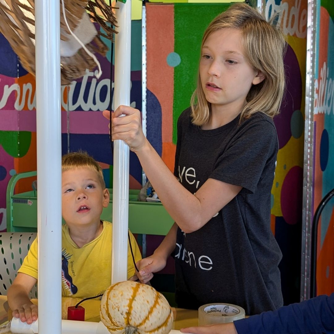 Boy holding molecule model
